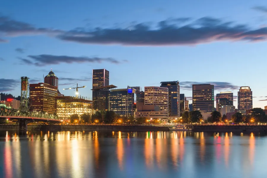 scenic view of downtown portland oregon with lights reflecting in water