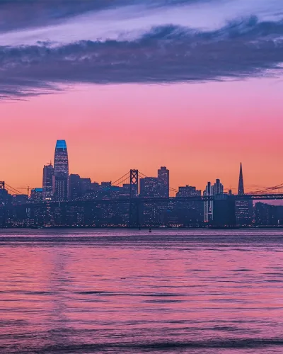 san francisco at sunset with oakland bay bridge
