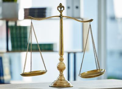 gold justice scales on desk